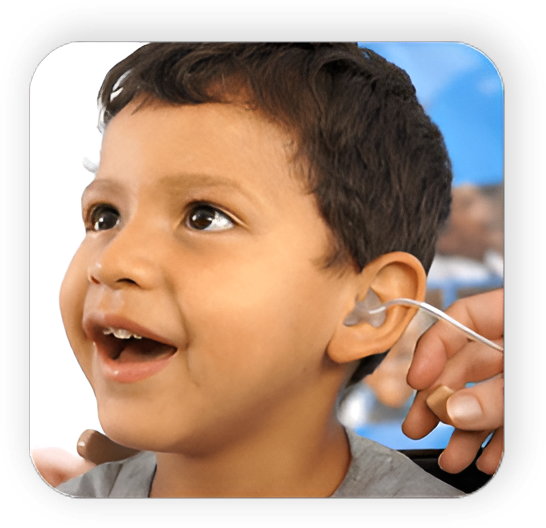 A child with an ear tag being fitted for a new hearing aid.