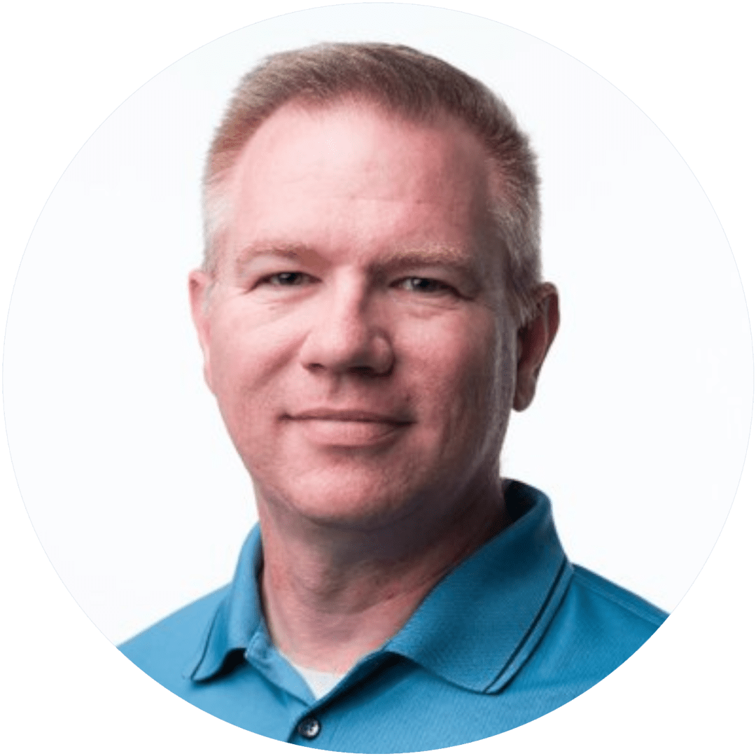 Headshot of man in blue polo shirt.